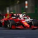 BAKU, AZERBAIJAN - JUNE 06: Carlos Sainz of Spain driving the (55) Scuderia Ferrari SF21 and Antonio Giovinazzi of Italy driving the (99) Alfa Romeo Racing C41 Ferrari battle for track position during the F1 Grand Prix of Azerbaijan at Baku City Circuit on June 06, 2021 in Baku, Azerbaijan. (Photo by Dan Istitene - Formula 1/Formula 1 via Getty Images)
