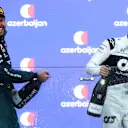 BAKU, AZERBAIJAN - JUNE 06: Second placed Sebastian Vettel of Germany and Aston Martin F1 Team and third placed Pierre Gasly of France and Scuderia AlphaTauri celebrate on the podium during the F1 Grand Prix of Azerbaijan at Baku City Circuit on June 06, 2021 in Baku, Azerbaijan. (Photo by Mark Thompson/Getty Images)