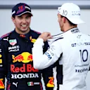BAKU, AZERBAIJAN - JUNE 06: Race winner Sergio Perez of Mexico and Red Bull Racing and third placed Pierre Gasly of France and Scuderia AlphaTauri talk in parc ferme during the F1 Grand Prix of Azerbaijan at Baku City Circuit on June 06, 2021 in Baku, Azerbaijan. (Photo by Mark Thompson/Getty Images)