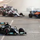 BAKU, AZERBAIJAN - JUNE 06: Lewis Hamilton of Great Britain driving the (44) Mercedes AMG Petronas F1 Team Mercedes W12 runs wide after locking up at the restart following a red flag period during the F1 Grand Prix of Azerbaijan at Baku City Circuit on June 06, 2021 in Baku, Azerbaijan. (Photo by Clive Rose/Getty Images)