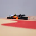 BAHRAIN, BAHRAIN - MARCH 26: Lando Norris of Great Britain driving the (4) McLaren F1 Team MCL35M Mercedes and Yuki Tsunoda of Japan driving the (22) Scuderia AlphaTauri AT02 Honda drive on track during practice ahead of the F1 Grand Prix of Bahrain at Bahrain International Circuit on March 26, 2021 in Bahrain, Bahrain. (Photo by Lars Baron/Getty Images)