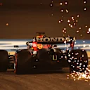 BAHRAIN, BAHRAIN - MARCH 26: Sparks fly behind Max Verstappen of the Netherlands driving the (33) Red Bull Racing RB16B Honda on track during practice ahead of the F1 Grand Prix of Bahrain at Bahrain International Circuit on March 26, 2021 in Bahrain, Bahrain. (Photo by Lars Baron/Getty Images)