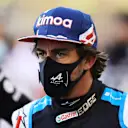 BAHRAIN, BAHRAIN - MARCH 28: Fernando Alonso of Spain and Alpine F1 Team looks on from the grid prior to the F1 Grand Prix of Bahrain at Bahrain International Circuit on March 28, 2021 in Bahrain, Bahrain. (Photo by Bryn Lennon/Getty Images)