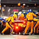 BAHRAIN, BAHRAIN - MARCH 28: Daniel Ricciardo of Australia driving the (3) McLaren F1 Team MCL35M Mercedes makes a pitstop during the F1 Grand Prix of Bahrain at Bahrain International Circuit on March 28, 2021 in Bahrain, Bahrain. (Photo by Mark Thompson/Getty Images)