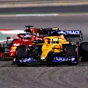 BAHRAIN, BAHRAIN - MARCH 28: Lando Norris of Great Britain driving the (4) McLaren F1 Team MCL35M Mercedes leads Charles Leclerc of Monaco driving the (16) Scuderia Ferrari SF21 during the F1 Grand Prix of Bahrain at Bahrain International Circuit on March 28, 2021 in Bahrain, Bahrain. (Photo by Lars Baron/Getty Images)