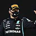 BAHRAIN, BAHRAIN - MARCH 28: Third placed Valtteri Bottas of Finland and Mercedes GP celebrates on the podium during the F1 Grand Prix of Bahrain at Bahrain International Circuit on March 28, 2021 in Bahrain, Bahrain. (Photo by Clive Mason - Formula 1/Formula 1 via Getty Images)