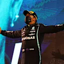 BAHRAIN, BAHRAIN - MARCH 28: Race winner Lewis Hamilton of Great Britain and Mercedes GP celebrates on the podium after the F1 Grand Prix of Bahrain at Bahrain International Circuit on March 28, 2021 in Bahrain, Bahrain. (Photo by Bryn Lennon/Getty Images)