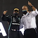 BAHRAIN, BAHRAIN - MARCH 28: Race winner Lewis Hamilton of Great Britain and Mercedes GP and Russell Braithwaite, Chief Financial Officer of Mercedes GP, celebrate on the podium during the F1 Grand Prix of Bahrain at Bahrain International Circuit on March 28, 2021 in Bahrain, Bahrain. (Photo by Lars Baron/Getty Images)
