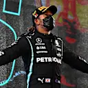 BAHRAIN, BAHRAIN - MARCH 28: Race winner Lewis Hamilton of Great Britain and Mercedes GP celebrates on the podium after the F1 Grand Prix of Bahrain at Bahrain International Circuit on March 28, 2021 in Bahrain, Bahrain. (Photo by Clive Mason - Formula 1/Formula 1 via Getty Images)