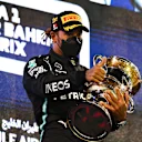 BAHRAIN, BAHRAIN - MARCH 28: Race winner Lewis Hamilton of Great Britain and Mercedes GP celebrates on the podium after the F1 Grand Prix of Bahrain at Bahrain International Circuit on March 28, 2021 in Bahrain, Bahrain. (Photo by Clive Mason - Formula 1/Formula 1 via Getty Images)