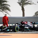 Hamilton brought out the red flags midway through the morning session after beaching his W12 in the gravel trap