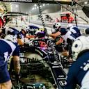 Pierre Gasly practices a pitstop under the lights