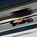 Norris flashes past in the McLaren MCL35M