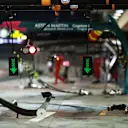 The McLaren F1 garage primed for action under the lights