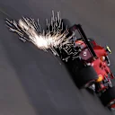 SPA, BELGIUM - AUGUST 27: Sparks fly behind Carlos Sainz of Spain driving the (55) Scuderia Ferrari SF21 during practice ahead of the F1 Grand Prix of Belgium at Circuit de Spa-Francorchamps on August 27, 2021 in Spa, Belgium. (Photo by Lars Baron/Getty Images)