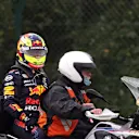 SPA, BELGIUM - AUGUST 29: Sergio Perez of Mexico and Red Bull Racing is given a lift back to the paddock after crashing on his way to the grid prior to the F1 Grand Prix of Belgium at Circuit de Spa-Francorchamps on August 29, 2021 in Spa, Belgium. (Photo by Lars Baron/Getty Images)