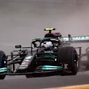 SPA, BELGIUM - AUGUST 29: Valtteri Bottas of Finland driving the (77) Mercedes AMG Petronas F1 Team Mercedes W12 on the way to the grid prior to the F1 Grand Prix of Belgium at Circuit de Spa-Francorchamps on August 29, 2021 in Spa, Belgium. (Photo by Joe Portlock - Formula 1/Formula 1 via Getty Images)