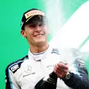 SPA, BELGIUM - AUGUST 29: Second placed George Russell of Great Britain and Williams celebrates on the podium during the F1 Grand Prix of Belgium at Circuit de Spa-Francorchamps on August 29, 2021 in Spa, Belgium. (Photo by Peter Fox/Getty Images)