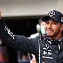 SAO PAULO, BRAZIL - NOVEMBER 12: Fastest qualifier Lewis Hamilton of Great Britain and Mercedes GP celebrates in parc ferme during qualifying ahead of the F1 Grand Prix of Brazil at Autodromo Jose Carlos Pace on November 12, 2021 in Sao Paulo, Brazil. (Photo by Lars Baron/Getty Images)