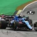 SAO PAULO, BRAZIL - NOVEMBER 13: Fernando Alonso of Spain driving the (14) Alpine A521 Renault leads Antonio Giovinazzi of Italy driving the (99) Alfa Romeo Racing C41 Ferrari during the sprint ahead of the F1 Grand Prix of Brazil at Autodromo Jose Carlos Pace on November 13, 2021 in Sao Paulo, Brazil. (Photo by Clive Mason - Formula 1/Formula 1 via Getty Images)