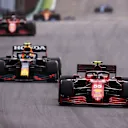 SAO PAULO, BRAZIL - NOVEMBER 13: Carlos Sainz of Spain driving the (55) Scuderia Ferrari SF21 leads Sergio Perez of Mexico driving the (11) Red Bull Racing RB16B Honda during the sprint ahead of the F1 Grand Prix of Brazil at Autodromo Jose Carlos Pace on November 13, 2021 in Sao Paulo, Brazil. (Photo by Lars Baron/Getty Images)