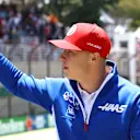 SAO PAULO, BRAZIL - NOVEMBER 14: Nikita Mazepin of Russia and Haas F1 waves to the crowd from the drivers parade before the F1 Grand Prix of Brazil at Autodromo Jose Carlos Pace on November 14, 2021 in Sao Paulo, Brazil. (Photo by Bryn Lennon - Formula 1/Formula 1 via Getty Images)