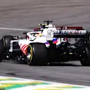 SAO PAULO, BRAZIL - NOVEMBER 14: Mick Schumacher of Germany driving the (47) Haas F1 Team VF-21 Ferrari collides with Kimi Raikkonen of Finland driving the (7) Alfa Romeo Racing C41 Ferrari during the F1 Grand Prix of Brazil at Autodromo Jose Carlos Pace on November 14, 2021 in Sao Paulo, Brazil. (Photo by Lars Baron/Getty Images)