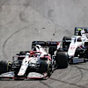 SAO PAULO, BRAZIL - NOVEMBER 14: Mick Schumacher of Germany driving the (47) Haas F1 Team VF-21 Ferrari collides with Kimi Raikkonen of Finland driving the (7) Alfa Romeo Racing C41 Ferrari during the F1 Grand Prix of Brazil at Autodromo Jose Carlos Pace on November 14, 2021 in Sao Paulo, Brazil. (Photo by Bryn Lennon - Formula 1/Formula 1 via Getty Images)