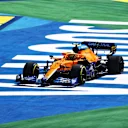 SAO PAULO, BRAZIL - NOVEMBER 14: Lando Norris of Great Britain driving the (4) McLaren F1 Team MCL35M Mercedes runs wide during the F1 Grand Prix of Brazil at Autodromo Jose Carlos Pace on November 14, 2021 in Sao Paulo, Brazil. (Photo by Bryn Lennon - Formula 1/Formula 1 via Getty Images)