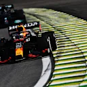 SAO PAULO, BRAZIL - NOVEMBER 14: Max Verstappen of the Netherlands driving the (33) Red Bull Racing RB16B Honda leads Lewis Hamilton of Great Britain driving the (44) Mercedes AMG Petronas F1 Team Mercedes W12 during the F1 Grand Prix of Brazil at Autodromo Jose Carlos Pace on November 14, 2021 in Sao Paulo, Brazil. (Photo by Clive Mason - Formula 1/Formula 1 via Getty Images)