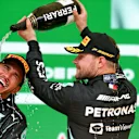 SAO PAULO, BRAZIL - NOVEMBER 14: Lewis Hamilton of Mercedes and Great Britain and Valterri Bottas of Mercedes and Finland celebrate finishing in first and third positions during the F1 Grand Prix of Brazil at Autodromo Jose Carlos Pace on November 14, 2021 in Sao Paulo, Brazil. (Photo by Peter Fox/Getty Images)