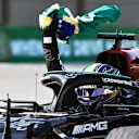 SAO PAULO, BRAZIL - NOVEMBER 14: Race winner Lewis Hamilton of Great Britain and Mercedes GP celebrates as he arrives into parc ferme during the F1 Grand Prix of Brazil at Autodromo Jose Carlos Pace on November 14, 2021 in Sao Paulo, Brazil. (Photo by Buda Mendes/Getty Images)