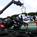 IMOLA, ITALY - APRIL 17: The car of Yuki Tsunoda of Japan and Scuderia AlphaTauri is removed from the circuit after crashing on track during qualifying ahead of the F1 Grand Prix of Emilia Romagna at Autodromo Enzo e Dino Ferrari on April 17, 2021 in Imola, Italy. (Photo by Lars Baron/Getty Images)