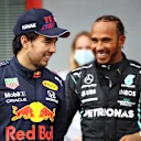 IMOLA, ITALY - APRIL 17: Second place qualifier Sergio Perez of Mexico and Red Bull Racing and pole position qualifier Lewis Hamilton of Great Britain and Mercedes GP talk in parc ferme during qualifying ahead of the F1 Grand Prix of Emilia Romagna at Autodromo Enzo e Dino Ferrari on April 17, 2021 in Imola, Italy. (Photo by Mark Thompson/Getty Images)