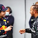 IMOLA, ITALY - APRIL 17: Second place qualifier Sergio Perez of Mexico and Red Bull Racing and pole position qualifier Lewis Hamilton of Great Britain and Mercedes GP talk in parc ferme during qualifying ahead of the F1 Grand Prix of Emilia Romagna at Autodromo Enzo e Dino Ferrari on April 17, 2021 in Imola, Italy. (Photo by Mark Thompson/Getty Images)