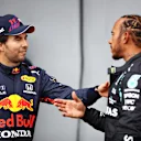 IMOLA, ITALY - APRIL 17: Second place qualifier Sergio Perez of Mexico and Red Bull Racing and pole position qualifier Lewis Hamilton of Great Britain and Mercedes GP talk in parc ferme during qualifying ahead of the F1 Grand Prix of Emilia Romagna at Autodromo Enzo e Dino Ferrari on April 17, 2021 in Imola, Italy. (Photo by Mark Thompson/Getty Images)