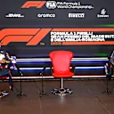 IMOLA, ITALY - APRIL 17:  Second place qualifier Sergio Perez of Mexico and Red Bull Racing and Third place qualifier Max Verstappen of Netherlands and Red Bull Racing wait for Pole position qualifier Lewis Hamilton of Great Britain and Mercedes GP during a press conference after qualifying ahead of the F1 Grand Prix of Emilia Romagna at Autodromo Enzo e Dino Ferrari on April 17, 2021 in Imola, Italy. (Photo by Mark Sutton - Pool/Getty Images)