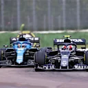 IMOLA, ITALY - APRIL 18: Pierre Gasly of France driving the (10) Scuderia AlphaTauri AT02 Honda and Fernando Alonso of Spain driving the (14) Alpine A521 Renault compete for position on track during the F1 Grand Prix of Emilia Romagna at Autodromo Enzo e Dino Ferrari on April 18, 2021 in Imola, Italy. (Photo by Lars Baron/Getty Images)
