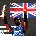 IMOLA, ITALY - APRIL 18: Third placed Lando Norris of Great Britain and McLaren F1 celebrates on the podium during the F1 Grand Prix of Emilia Romagna at Autodromo Enzo e Dino Ferrari on April 18, 2021 in Imola, Italy. (Photo by Bryn Lennon/Getty Images)