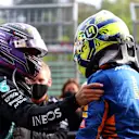 IMOLA, ITALY - APRIL 18: Second placed Lewis Hamilton of Great Britain and Mercedes GP and third placed Lando Norris of Great Britain and McLaren F1 hug in parc ferme during the F1 Grand Prix of Emilia Romagna at Autodromo Enzo e Dino Ferrari on April 18, 2021 in Imola, Italy. (Photo by Bryn Lennon/Getty Images)