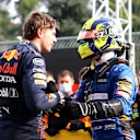 IMOLA, ITALY - APRIL 18: Race winner Max Verstappen of Netherlands and Red Bull Racing and third placed Lando Norris of Great Britain and McLaren F1 celebrate in parc ferme during the F1 Grand Prix of Emilia Romagna at Autodromo Enzo e Dino Ferrari on April 18, 2021 in Imola, Italy. (Photo by Bryn Lennon/Getty Images)