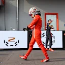 IMOLA, ITALY - APRIL 18: Fourth placed Charles Leclerc of Monaco and Ferrari walks in parc ferme after the F1 Grand Prix of Emilia Romagna at Autodromo Enzo e Dino Ferrari on April 18, 2021 in Imola, Italy. (Photo by Bryn Lennon/Getty Images)