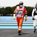 LE CASTELLET, FRANCE - JUNE 19: Yuki Tsunoda of Japan and Scuderia AlphaTauri walks off the circuit after spinning during qualifying ahead of the F1 Grand Prix of France at Circuit Paul Ricard on June 19, 2021 in Le Castellet, France. (Photo by Dan Istitene - Formula 1/Formula 1 via Getty Images)