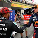LE CASTELLET, FRANCE - JUNE 19: Pole position qualifier Max Verstappen of Netherlands and Red Bull Racing and second placed qualifier Lewis Hamilton of Great Britain and Mercedes GP interact in parc ferme during qualifying ahead of the F1 Grand Prix of France at Circuit Paul Ricard on June 19, 2021 in Le Castellet, France. (Photo by Nicolas Tucat - Pool/Getty Images)