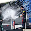 LE CASTELLET, FRANCE - JUNE 20: Third placed Sergio Perez of Mexico and Red Bull Racing and second placed Lewis Hamilton of Great Britain and Mercedes GP celebrate with sparkling wine on the podium during the F1 Grand Prix of France at Circuit Paul Ricard on June 20, 2021 in Le Castellet, France. (Photo by Joe Portlock - Formula 1/Formula 1 via Getty Images)