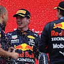 LE CASTELLET, FRANCE - JUNE 20: Red Bull Racing race engineer Gianpiero Lambiase, race winner Max Verstappen of Netherlands and Red Bull Racing and third placed Sergio Perez of Mexico and Red Bull Racing celebrate with sparkling wine on the podium during the F1 Grand Prix of France at Circuit Paul Ricard on June 20, 2021 in Le Castellet, France. (Photo by Bryn Lennon - Formula 1/Formula 1 via Getty Images)