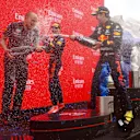 LE CASTELLET, FRANCE - JUNE 20: Red Bull Racing race engineer Gianpiero Lambiase, race winner Max Verstappen of Netherlands and Red Bull Racing and third placed Sergio Perez of Mexico and Red Bull Racing celebrate on the podium with sparkling wine during the F1 Grand Prix of France at Circuit Paul Ricard on June 20, 2021 in Le Castellet, France. (Photo by Dan Istitene - Formula 1/Formula 1 via Getty Images)