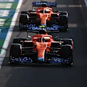NORTHAMPTON, ENGLAND - JULY 16: Lando Norris of Great Britain driving the (4) McLaren F1 Team MCL35M Mercedes leads Daniel Ricciardo of Australia driving the (3) McLaren F1 Team MCL35M Mercedes out of the pitlane during qualifying ahead of the F1 Grand Prix of Great Britain at Silverstone on July 16, 2021 in Northampton, England. (Photo by Mark Thompson/Getty Images)
