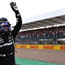NORTHAMPTON, ENGLAND - JULY 16: Fastest qualifier Lewis Hamilton of Great Britain and Mercedes GP celebrates in parc ferme during qualifying ahead of the F1 Grand Prix of Great Britain at Silverstone on July 16, 2021 in Northampton, England. (Photo by Lars Baron/Getty Images)
