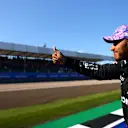 NORTHAMPTON, ENGLAND - JULY 17: Second placed Lewis Hamilton of Great Britain and Mercedes GP waves to the crowd on the Victory Lap during the Sprint for the F1 Grand Prix of Great Britain at Silverstone on July 17, 2021 in Northampton, England. (Photo by Dan Istitene - Formula 1/Formula 1 via Getty Images)